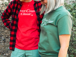 Meghan has on the Peninsula Park Green Tee